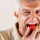 Man biting into cherry tomato