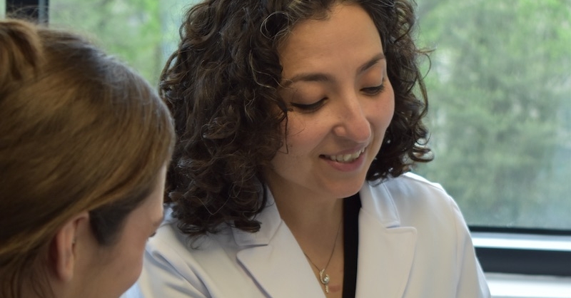 Dr. Taghechian with a patient