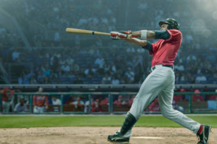 Photo of a baseball player swinging.