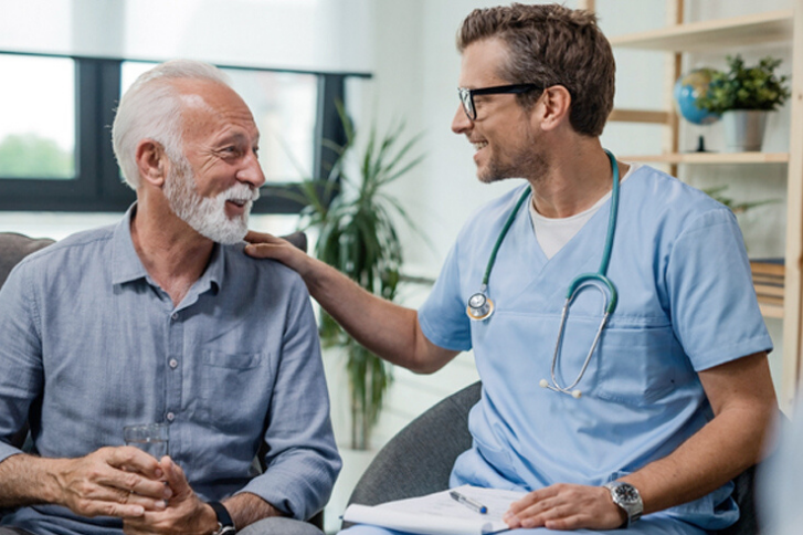 Doctor reassuring male patient.