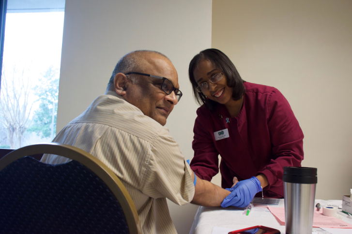 A photo of man getting his prostate screened at the free event.