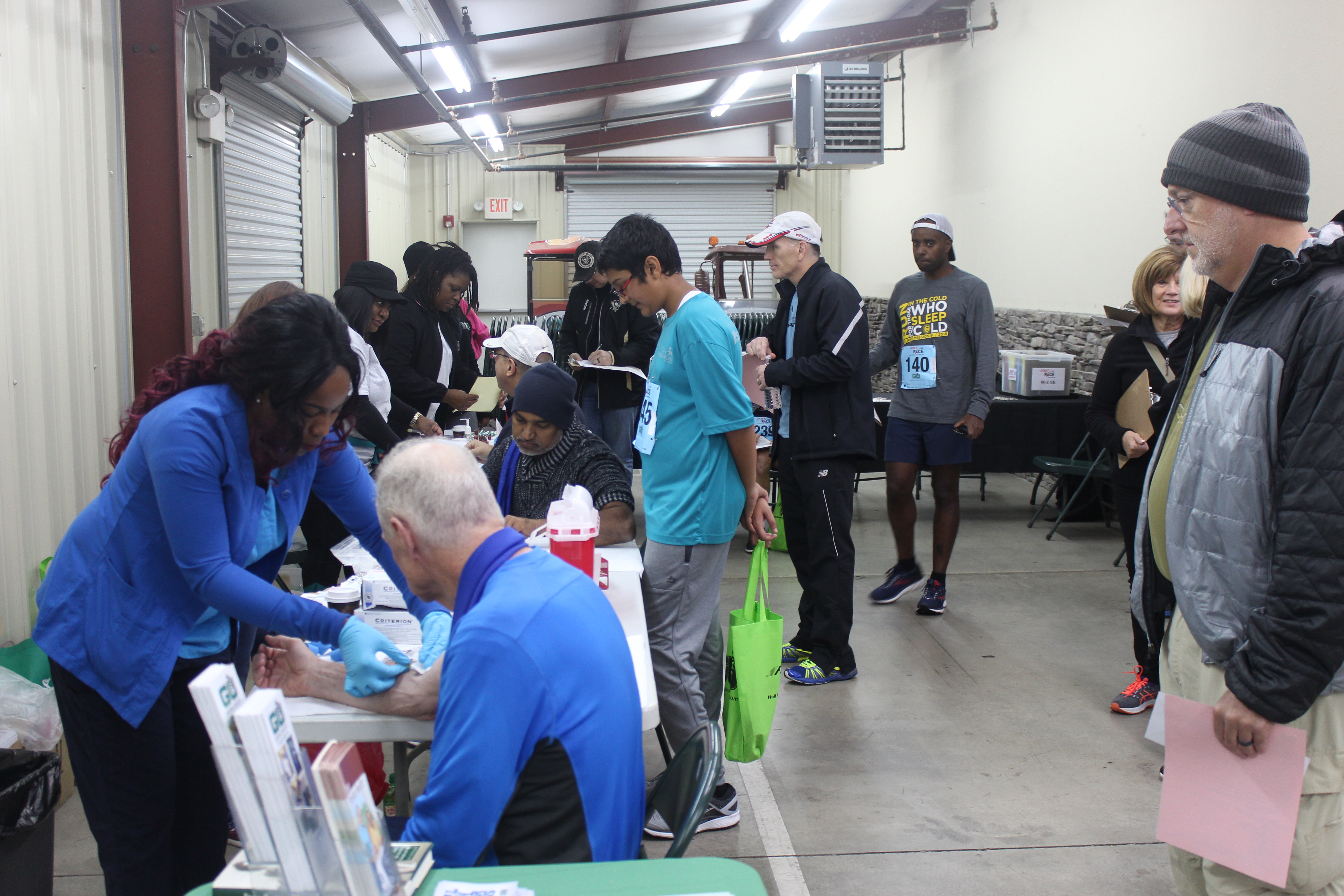 Photo of the F.A.S.T P.A.C.E event, GU nurses getting the prostate cancer readings for participants.