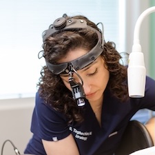 Dr. Taghechian examining patient