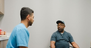 Doctor speaking with patient in room
