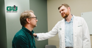 Dr. Kemper placing hand on patients shoulder in supportive way