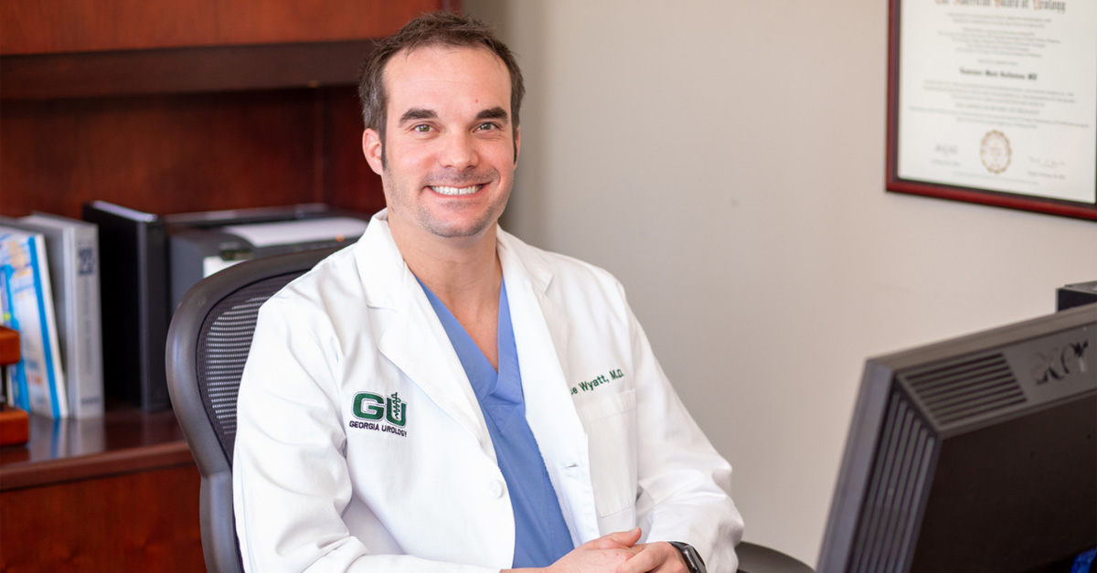 Dr. Bryce Wyatt smiling in his office.