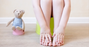 close-up-of-legs-of-the-child-sitting-on-the-potty