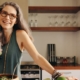 healthy senior woman smiling holding green juice