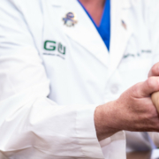 Doctor holding hands of patient