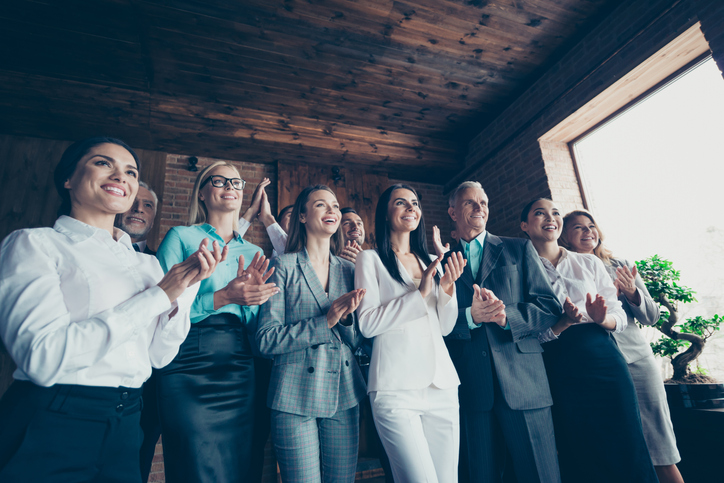 Business family concept. Photo of ecstatic elegant in classic suit jacket blazer confident crowd clapping hands stand look at speaker boss chief ceo chairman in loft interior room.