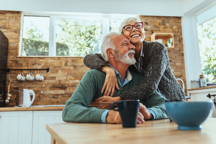 Shot of a mature woman hugging her husband