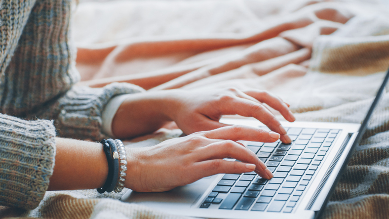 Remote job. Freelance technical content writer. Woman working from home. Closeup of female hands typing on laptop..