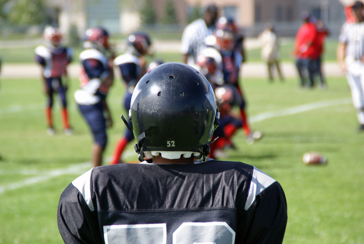 Football team member joining the game.