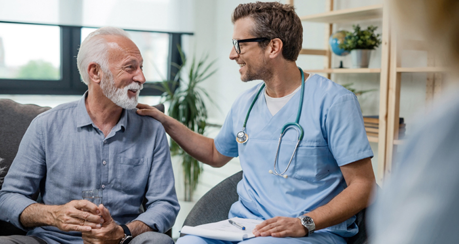 Doctor reassuring male patient.