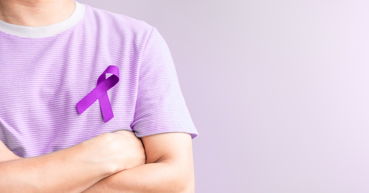 Person wearing a purple ribbon