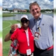 Smiling woman and man at golf game